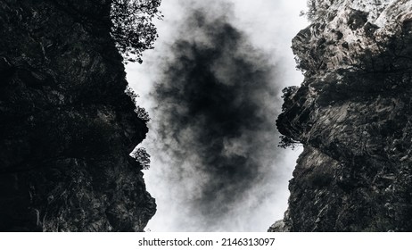 Black Cloud Stuck Between Two Rocks