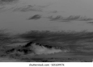 Black clouds on a dark background