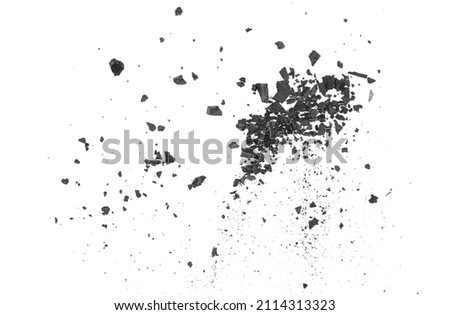 Black coal dust with fragments, effect explosion isolated on white background and texture, top view