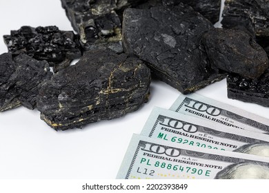 Black Coal Lumps With Cash Money. Fossil Fuel, Air Pollution And Coal Mining Industry Concept.