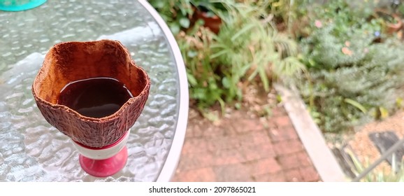 Black Coffee In Cocoa Husk.It Morning Drink In Garden