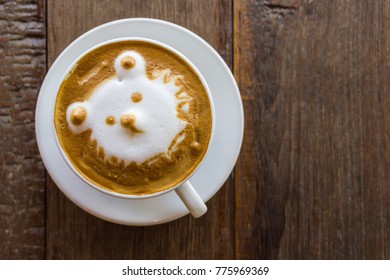 Black Coffee Latte Art Face Bear Image In White Cup On Wood Table