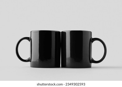 Black coffee mug mockup on a grey background.