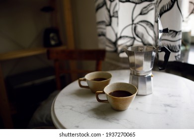 Black Coffee In Two Cups On A White Marble Table. Morning Coffee Ritual