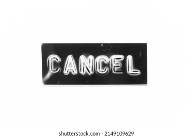 Black color banner that have embossed letter with word cancel on white paper background