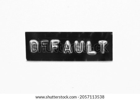 Black color banner that have embossed letter with word default on white paper background