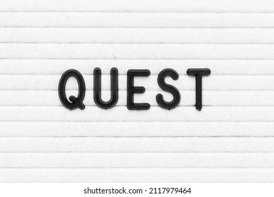 Black Color Letter In Word Quest On White Felt Board Background