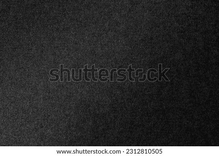 Black color velvet paper texture background.
