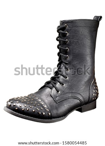 Black combat boot with studded toe and heel on white background