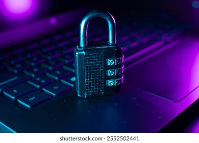 A black combination padlock placed on a keyboard, illuminated by blue and purple neon lights, symbolizing cybersecurity, data protection, and digital safety.
 - Powered by Shutterstock