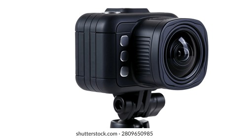 Black compact action camera with wide angle lens mounted on tripod