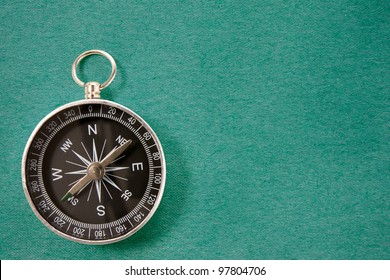 black compass on the blue  background - Shutterstock ID 97804706