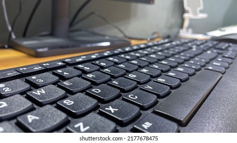 Black computer keyboard button in the table at the office