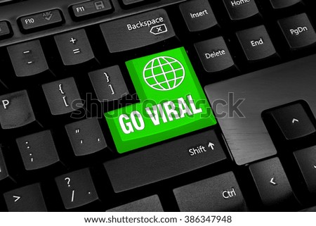 Black Computer keyboard with green go viral button