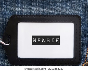 Black corporate ID card on jeans background with text label NEWBIE, refers to inexperienced newcomer wirker employee in the workplace,one who has just started doing activity or first jobber - Shutterstock ID 2219858727
