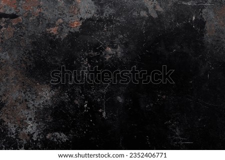 Black, corroded metal texture background with rusty parts