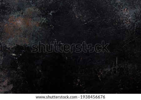 Black, corroded and rusty metal texture background 