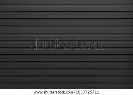black corrugate wall background and texture, black metal panel