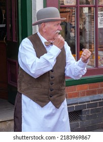 Black Country Museum,UK June 2022, Vintage Street  Shop Keeper Fighting Scene Quarrel With Fisticuffs,  Reenactments At Museum. West Midlands