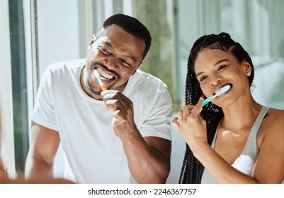 Black couple, brushing teeth and dental cleaning in bathroom together for grooming hygiene, beauty wellness and healthcare with toothbrush. African man, woman and happy oral care morning routine - Powered by Shutterstock