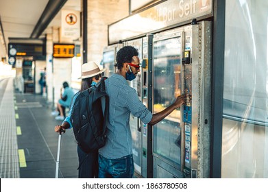 Black Couple Choosing Beverage And Food In Vending Machine At Train Station - Man And Girl Wear Surgical Mask Selecting Soft Drink At Modern Beverage Vending Machine - Self-service Device