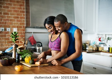 Black Couple Cooking Healthy Food In The Kitchen