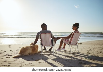 Black couple, dog and sunset beach while on chair to relax on vacation holding hands for love, care and trust by ocean for quality time. Pet with man and woman in healthy marriage on holiday by sea - Powered by Shutterstock