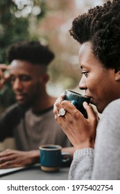 Black Couple Drinking Coffee In The Garden