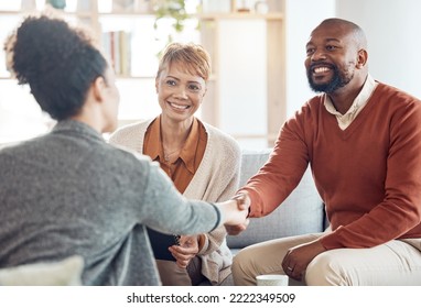 Black Couple, Financial Advisor And Handshake On Home Sofa For Discussion With Broker And Shaking Hands For Agreement, Contract And Deal. Happy Man And Woman Talking To Agent For Insurance Or Loan