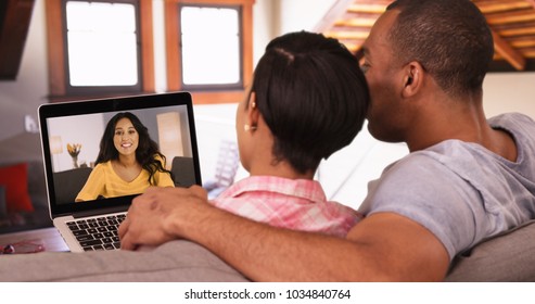 A black couple has a video call with their Caucasian friend