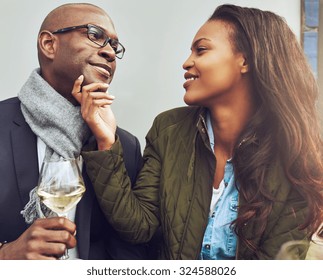 Black Couple Having A Good Time On A Cafe In The Spring