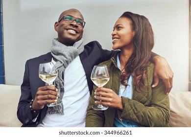 Black Couple Having A Good Time Drinking A Glass Of Wine