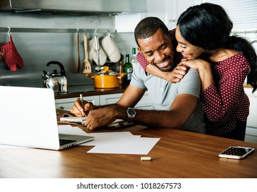 Black couple hugging together