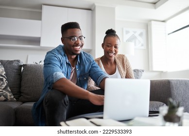 Black couple, laptop and planning finance budget, bills and loan with network connection or home wifi on living room couch. Man and woman on social media, banking website or doing online shopping - Powered by Shutterstock