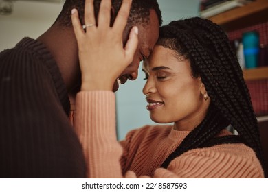 Black couple, love and care while together for happiness in a happy marriage with commitment and care. Young man and woman touching face of head while in a house to bond, intimate and show commitment - Powered by Shutterstock