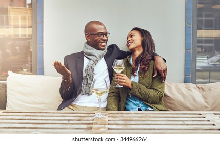 Black Couple On A Date Enjoying A Glass Og Wine