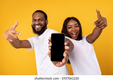 Black Couple Showing Blank Empty Smartphone Screen For Mockup