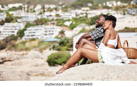 Black Couple, Summer Beach Picnic And Romantic Date With Love, Relax And Bonding On Sunny Day Outdoor Together. Young, Smile And Happy African American People Enjoying Carefree Quality Time At Coast