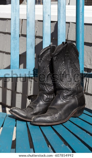Black Cowboy Boots On Blue Rocking Stock Photo Edit Now 607854992