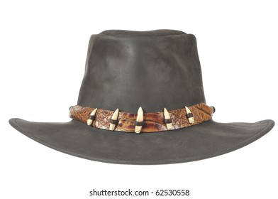 A black cowboy hat with crocodale teeth in front on white background.