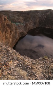 Black Crater Lake At Mount Kelimutu During Sunrise