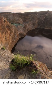 Black Crater Lake At Mount Kelimutu During Sunrise