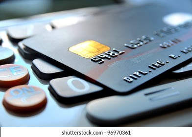 Black credit card on a calculator