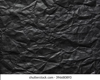 Black Crumpled Paper As A Background