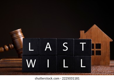 Black Cubes With Words Last Will On Wooden Table Against Dark Background