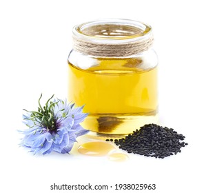 Black Cumin Oil With Nigella Sativa Flower In Closeup On White Background