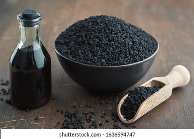 Black Cumin Or Roman Coriander Seeds And Black Caraway Oil Bottle. Ingredients For Cooking. Ayurveda Natural Treatments.