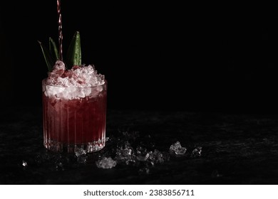 Black Currant Cocktail, with Pineapple slices and leaves for garnish. Crushed ice, black background and copy paste space - Powered by Shutterstock