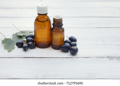 Black Currant Extract (oil, Tincture, Remedy, Infusion) Bottle On White Wooden Background