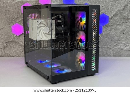 black custom gaming pc computer with glass windows and colorful bright rgb rainbow led lighting 
